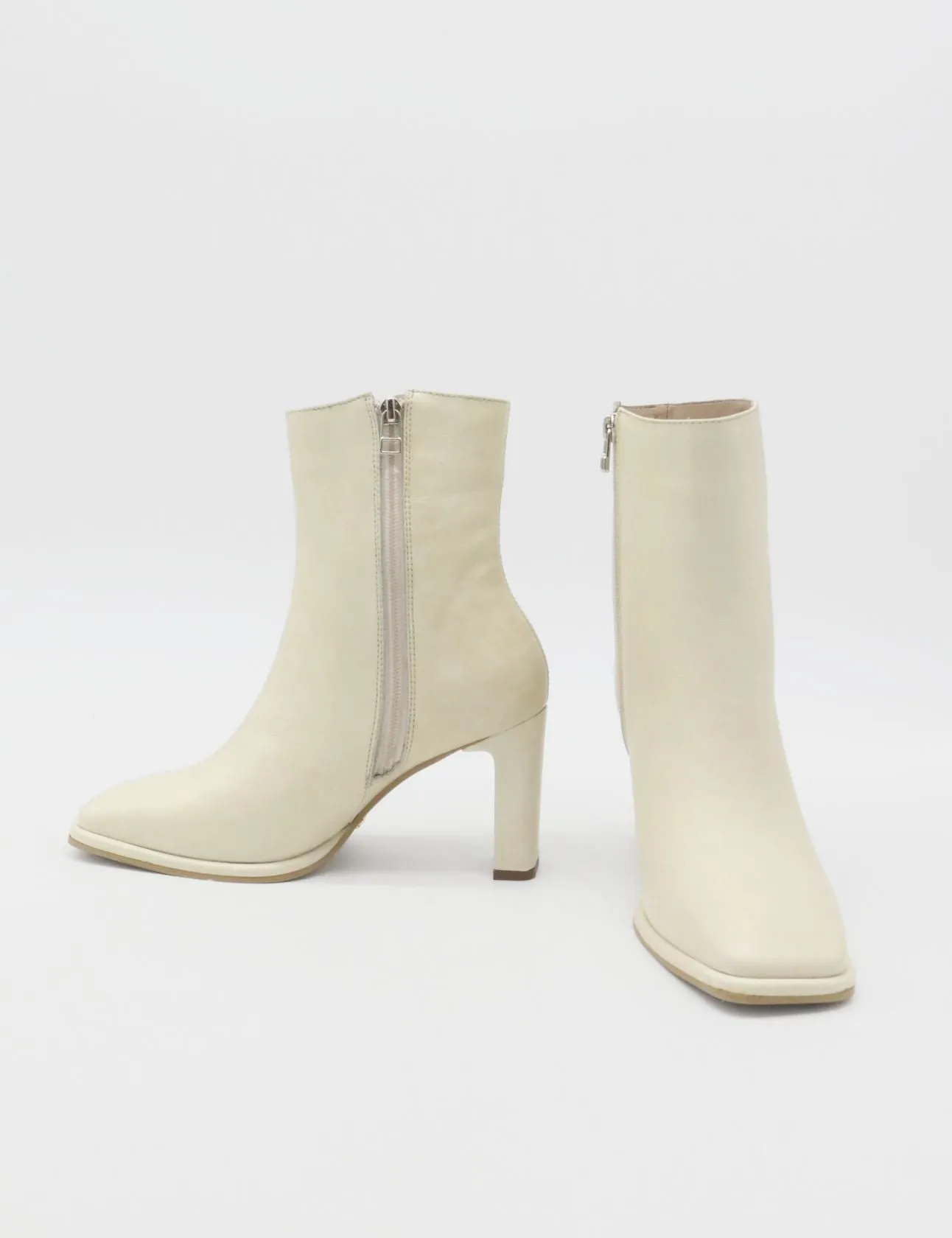 Indigo heeled ankle boots in off white leather womens shoes